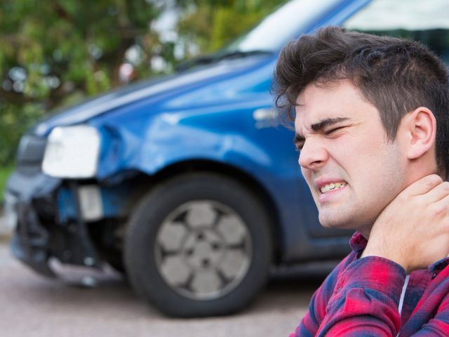 Male Motorist Suffering From Whiplash After Car Accident car accidents